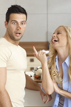 Young couple having fun in kitchen