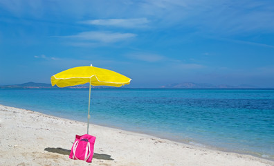 bag and umbrella at the beach