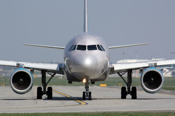 Taxiing silver plane