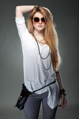 beautiful girl is in fashion style on  grey  background