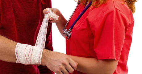 Nurse putting  a bandage to a  injured hand