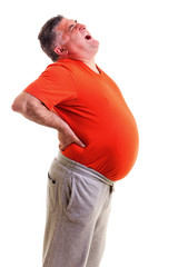 Overweight man with acute back ache bending over backwards to at