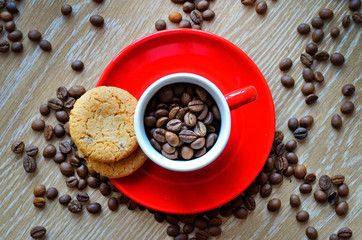 cup with coffee beans on a dark background