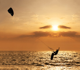Kite surfer jumping from the water
