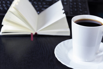 With a cup of coffee