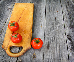 Red tomato on vintage table