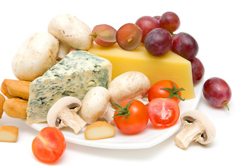 cheese, mushrooms, tomatoes and grapes close-up