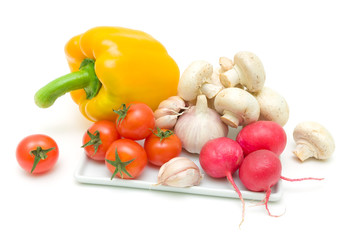 fresh vegetables and mushrooms on a white background