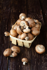 Fresh whole button mushrooms in a basket