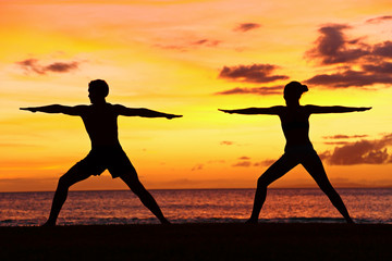 Yoga people training and meditating warrior pose