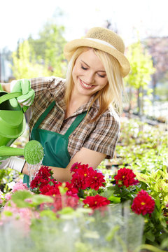 Female florist or gardener in flower shop or nursery