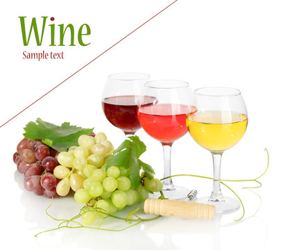 Glasses of wine and ripe grapes isolated on white