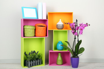 Beautiful colorful shelves with different home related objects