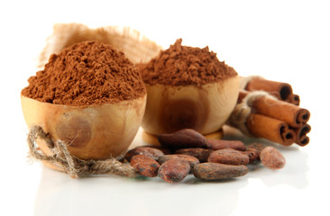 Cocoa powder in wooden bowls and spices, isolated on white