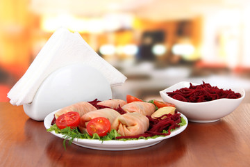 Stuffed cabbage rolls on table in cafe