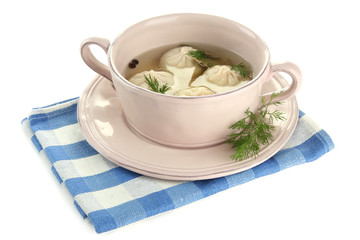 Tasty khinkali in .saucepan, isolated on white