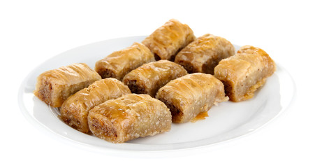 Sweet baklava on plate isolated on white
