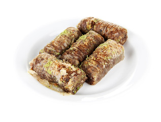 Sweet baklava on plate isolated on white