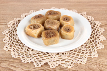 Sweet baklava on plate on table