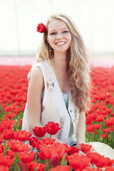 beauty young woman with flowers tulips