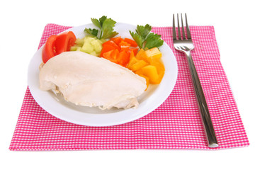 Boiled chicken breast on plate with vegetables isolated on