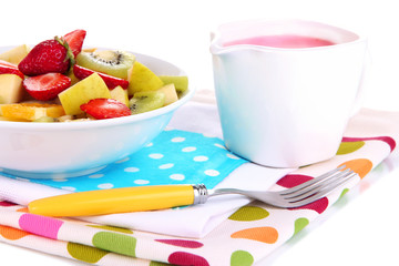 Useful fruit salad of fresh fruits and berries in bowl isolated