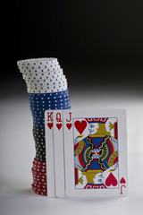 Card Hand With gaming Chips.