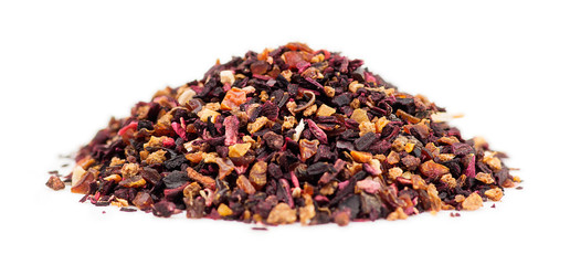 Macro of rose hip tea loose leaf granules in a pile on white