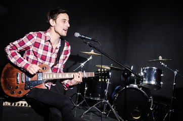 Man playing guitar during concert