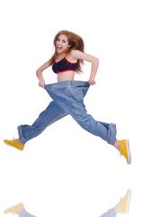 Woman in dieting concept with big jeans