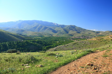 Fototapeta na wymiar village between hills