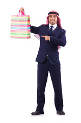 Arab man with shopping gifts on white