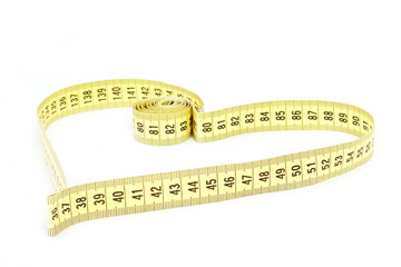 Tape measure heart shape - health, weight concept