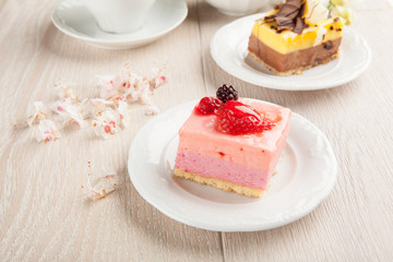 Cream pastries with chocolate and strawberries