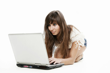 Young woman working with laptop on white background