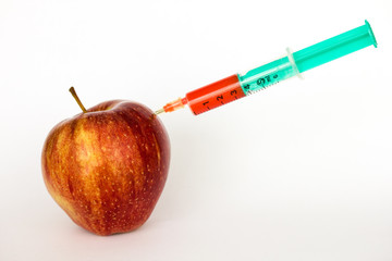 Red apple and syringes isolated on white