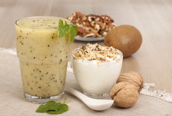 Fitness breakfast with yogurt, smoothies out of kiwi fruit and w