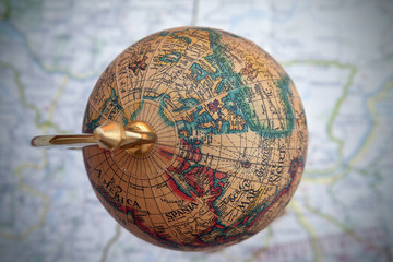 Worldwide globe over a map