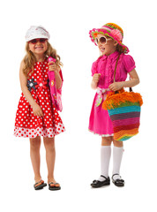 Two girls are dressed for summer