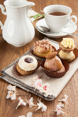 Pastries with chocolate and cream with tea