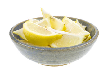 Lemon wedges in old bowl