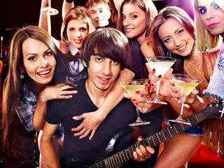 Band playing musical  instrument.