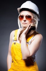 Fashionable young architect woman, construction worker