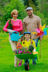 Gardening - happy family  working in the garden