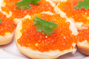 Sandwiches with red salted caviar