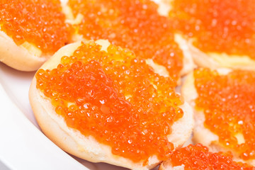 Sandwiches with red salted caviar