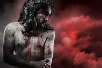 Fototapeta na wymiar Jesus Christ over red cloudscape, calvary concept