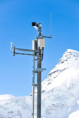 Weather Measurement Instrument with snow mountain in background