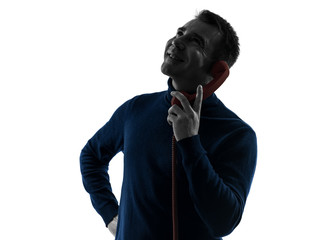 man on the phone smiling silhouette portrait