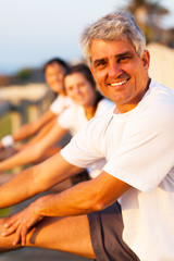 middle aged man stretching before exercise